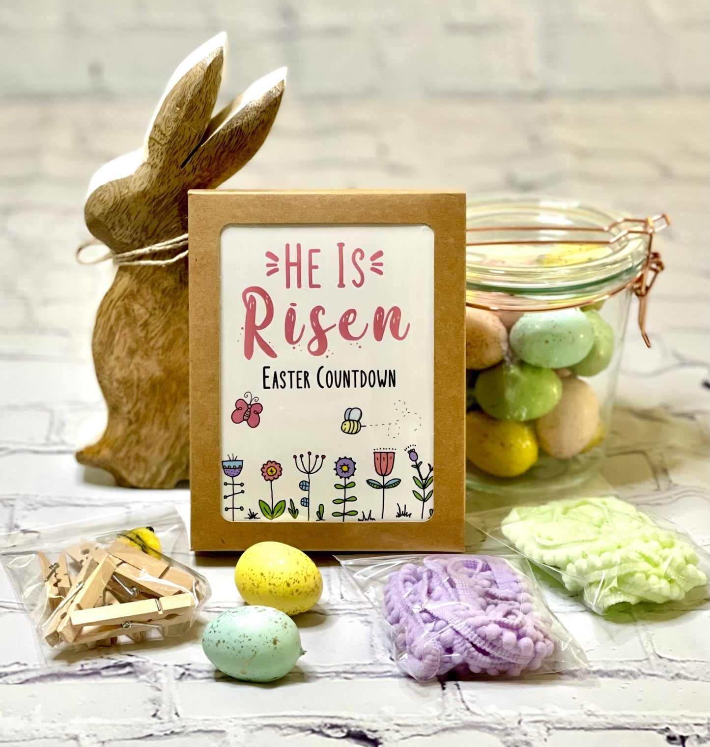 HE IS RISEN EASTER COUNTDOWN BOXED SET (includes 9 premium cards, Pom Pom trim, clothespins, and fuzzy bumblebee)